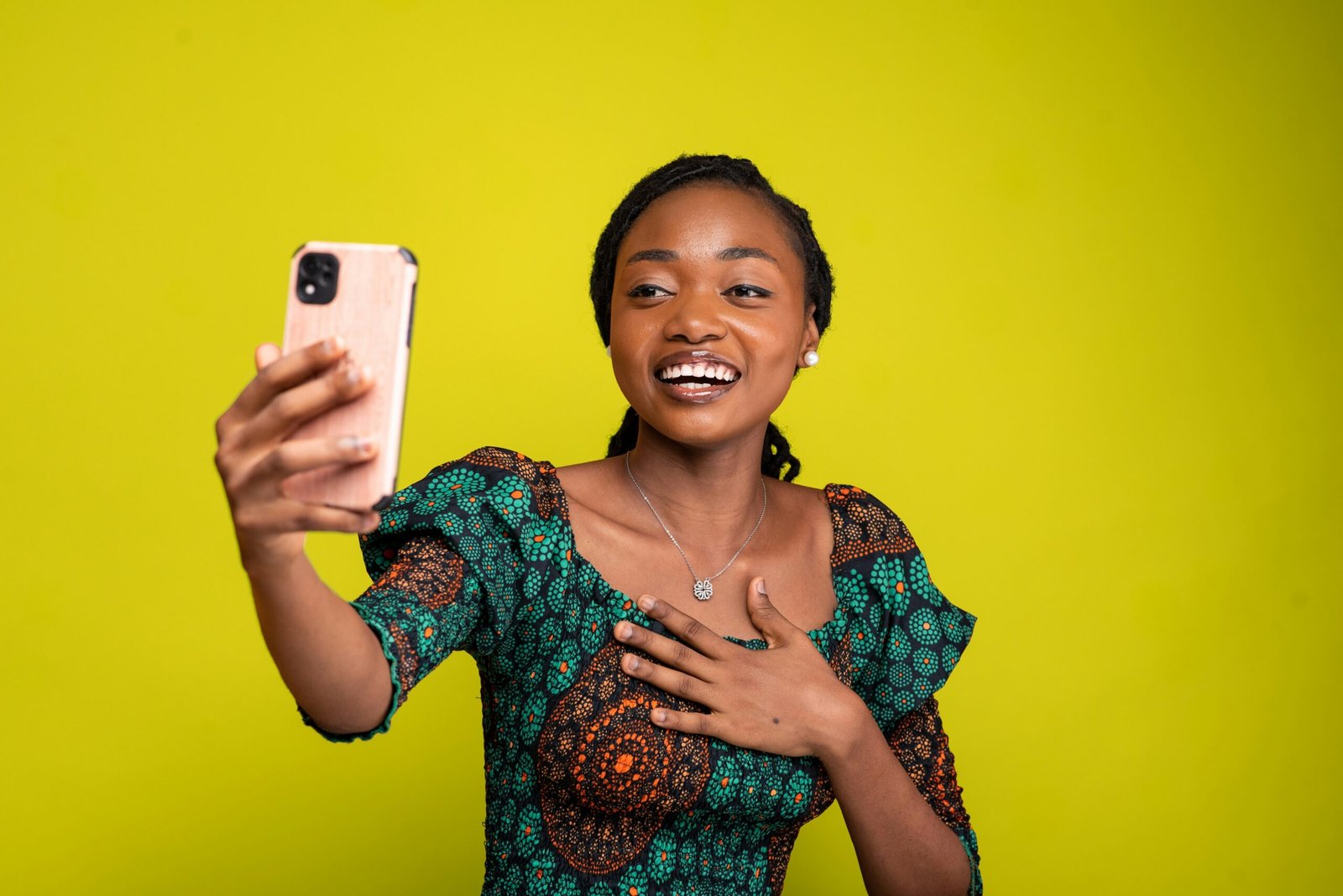 a woman taking a selfie with her cell phone