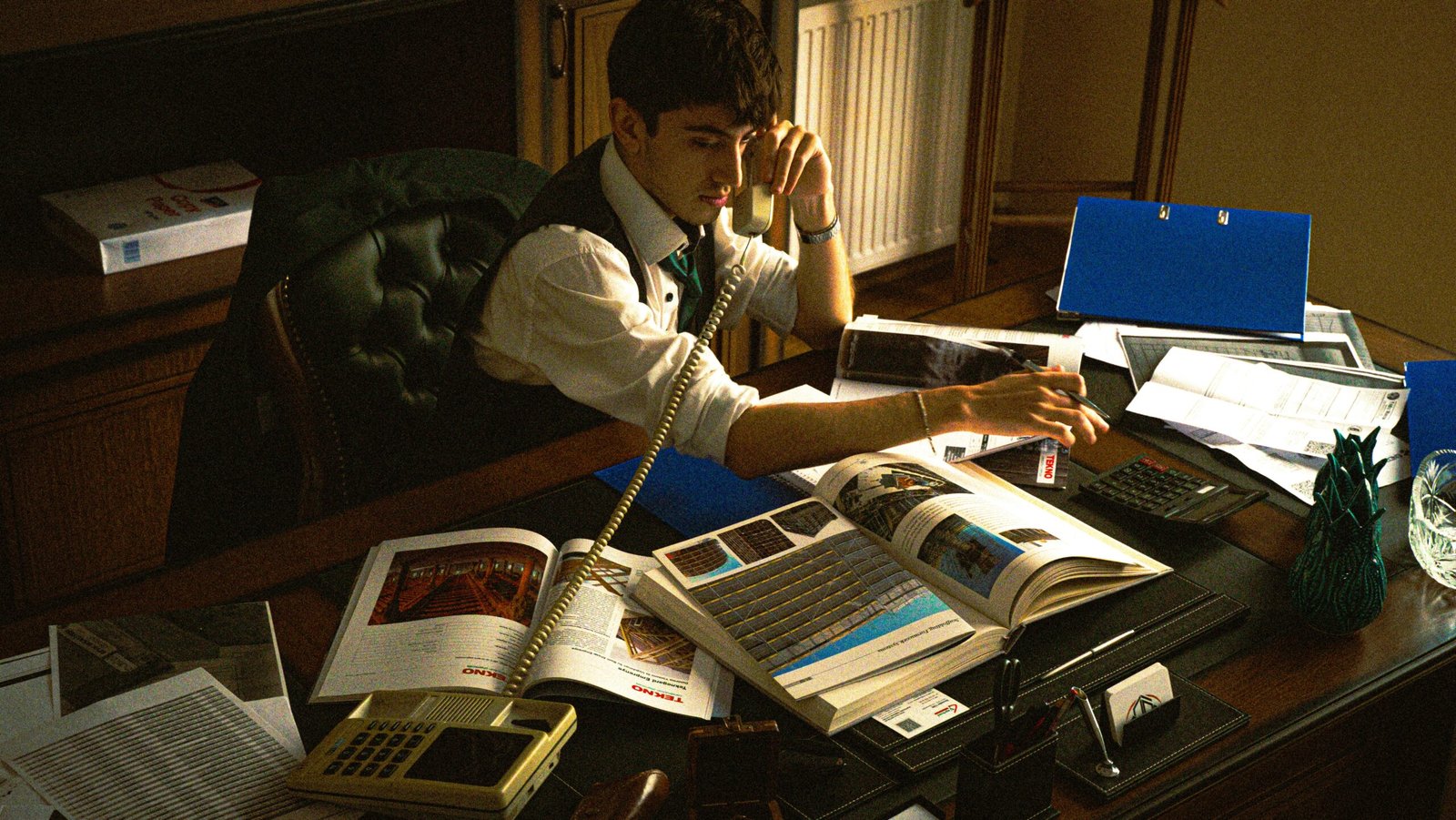 A person sitting at a desk with a laptop