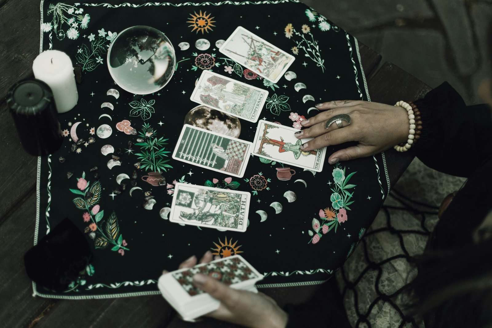 Tarot cards and crystals are used for divination.