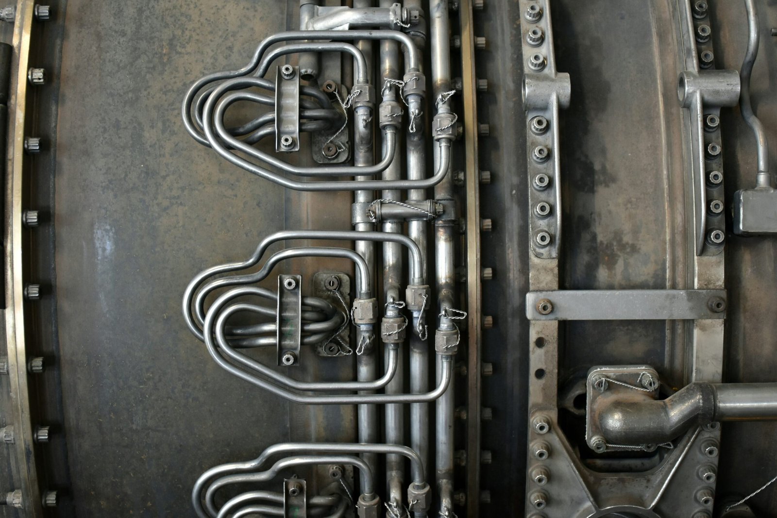 Close-up of industrial metal pipes and machinery.