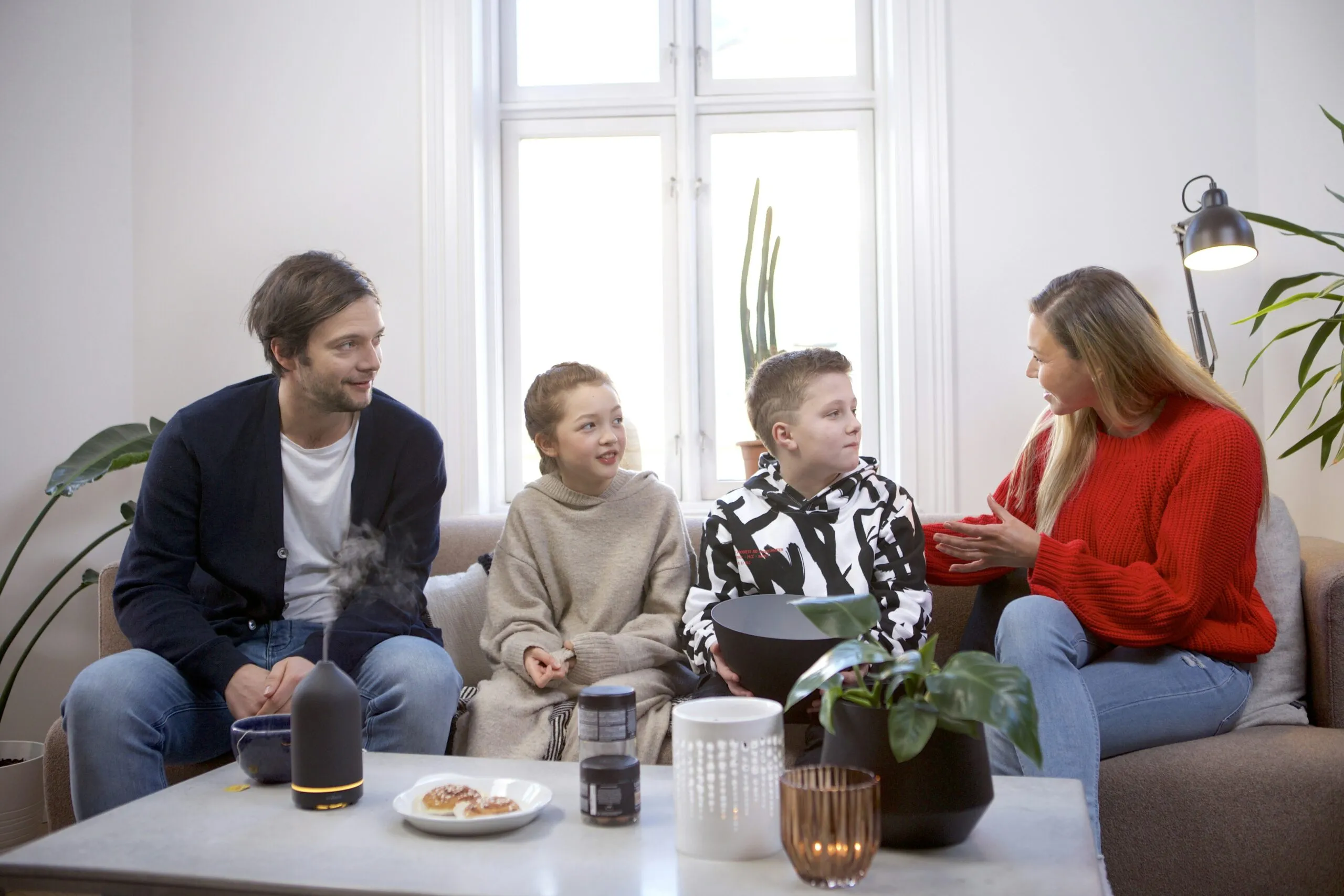 a group of people sitting on top of a couch