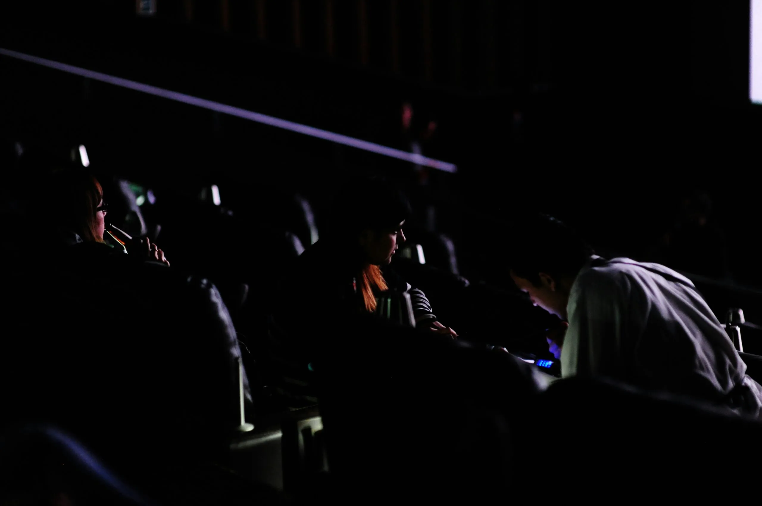 people sitting on chair inside room