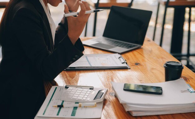 Asian women are stressed while working on laptop Tired asian businesswoman with headache at office feeling sick at work copy space