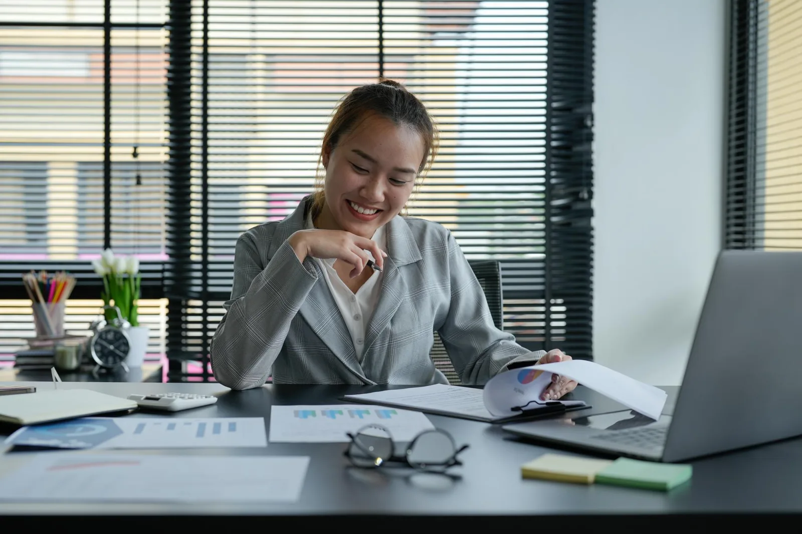 Business asian woman Discussing planning analyzing financial document data charts and graphs in office