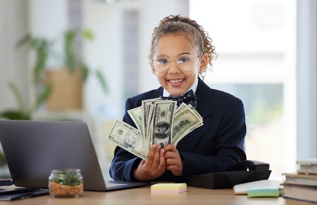 Business portrait of girl child and cash smile and glasses education in money management or budget planning Happy corporate kid in suit saving and investing in future finance with kids in office
