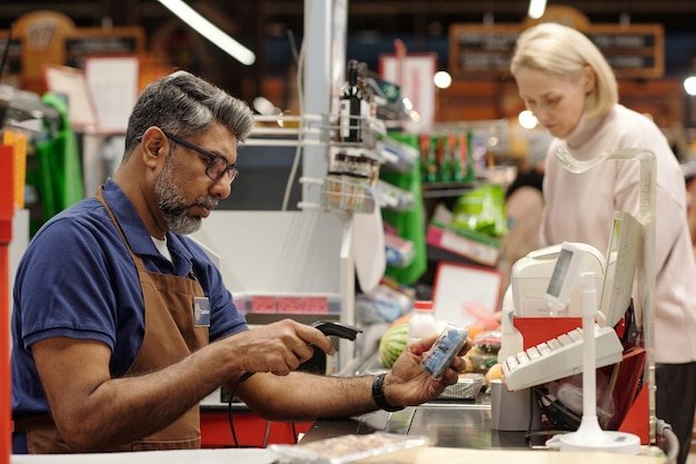 Cashier working in supermarket