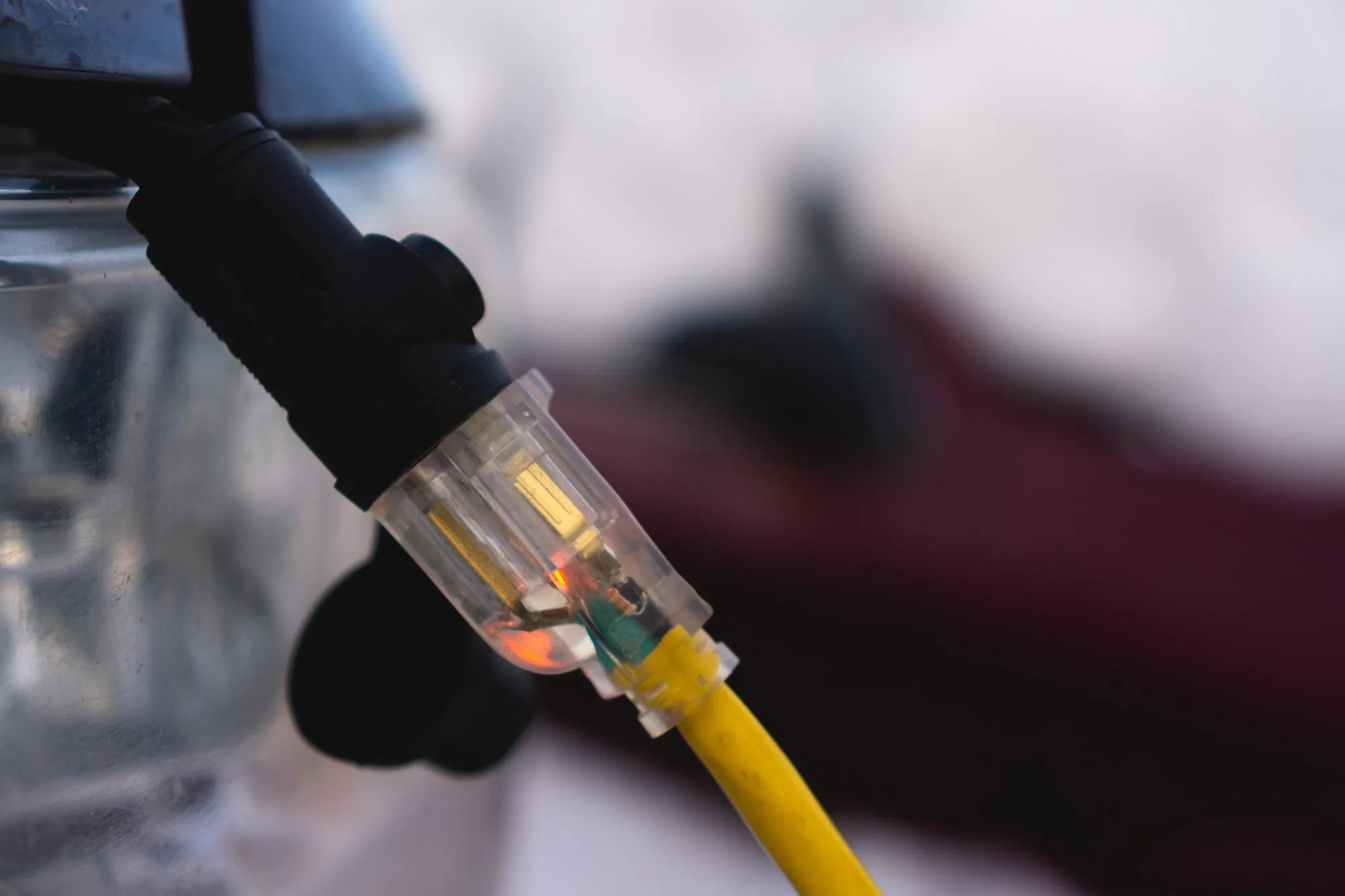 Close up of extension cord attached to truck