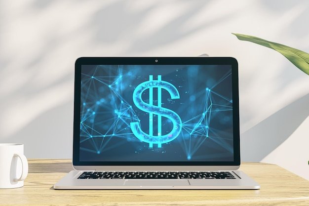Close up of laptop on wooden desk with coffee cup and digital dollar sign on concrete wall background with shadows Digital banking technology and cryptocurrency concept 3D Rendering