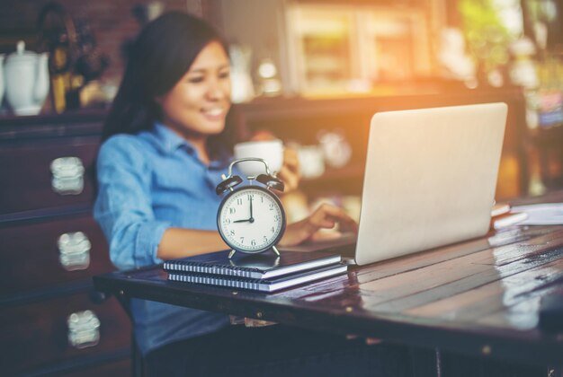 Close-up of woman using mobile phone at home