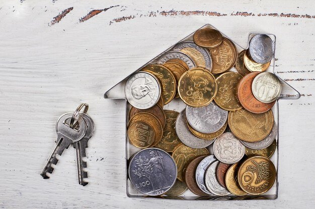 Coins in houseshaped form keys purchase of dream