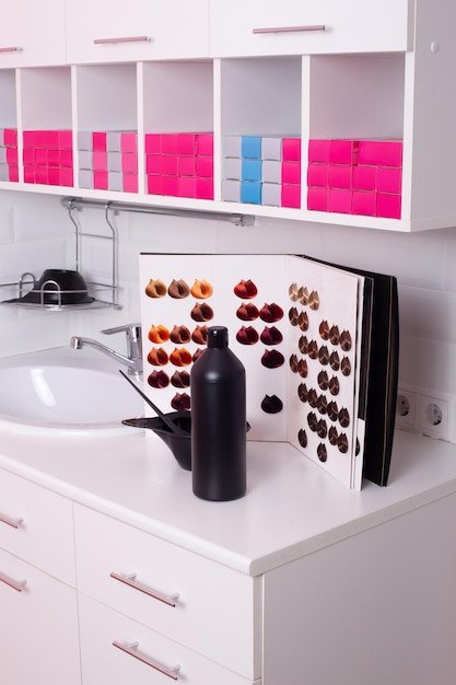 Color bar with sink and working tools in hairdressing salon