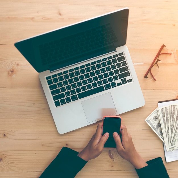 Cropped image of business person working at desk in office
