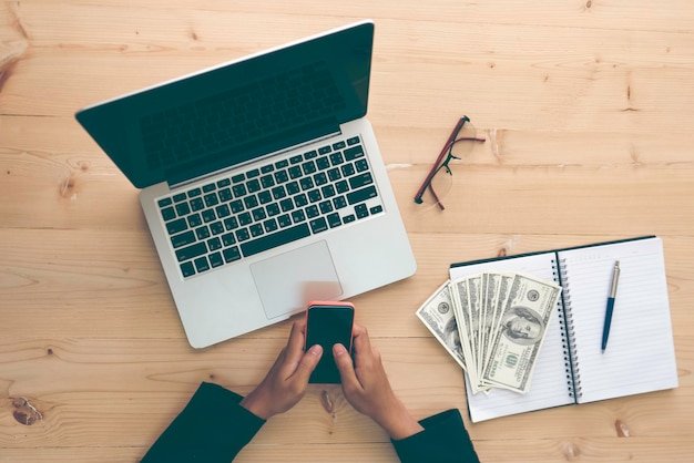 Cropped image of business person working at desk in office