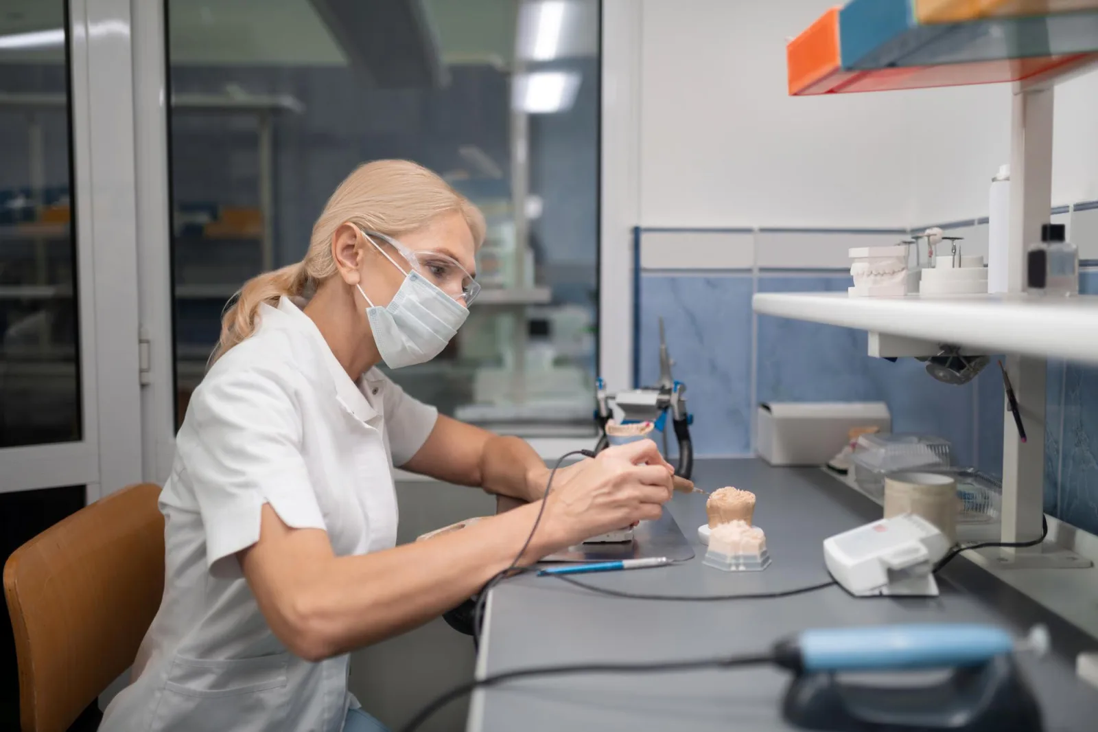 Dental technician making porcelain veneers for the patient