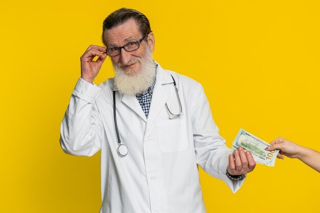 Doctor man receive bribe from patient taking money from client hiding cash into pocket corruption