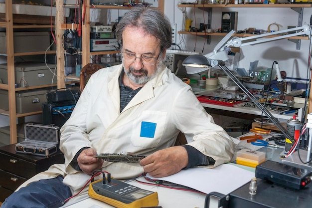 Electronic engineer is working in his laboratory