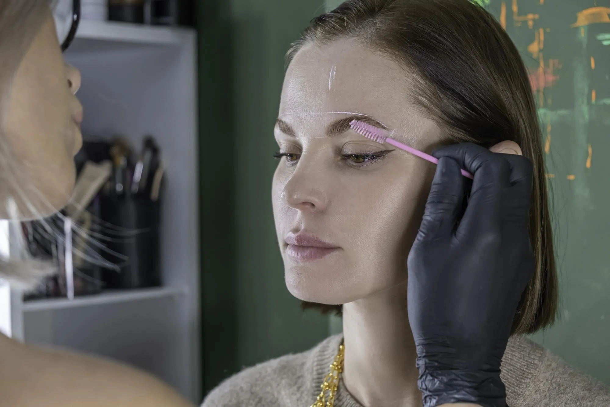 Eyebrow lamination procedure styling correction coloring and in beauty salon eye brow care treatment
