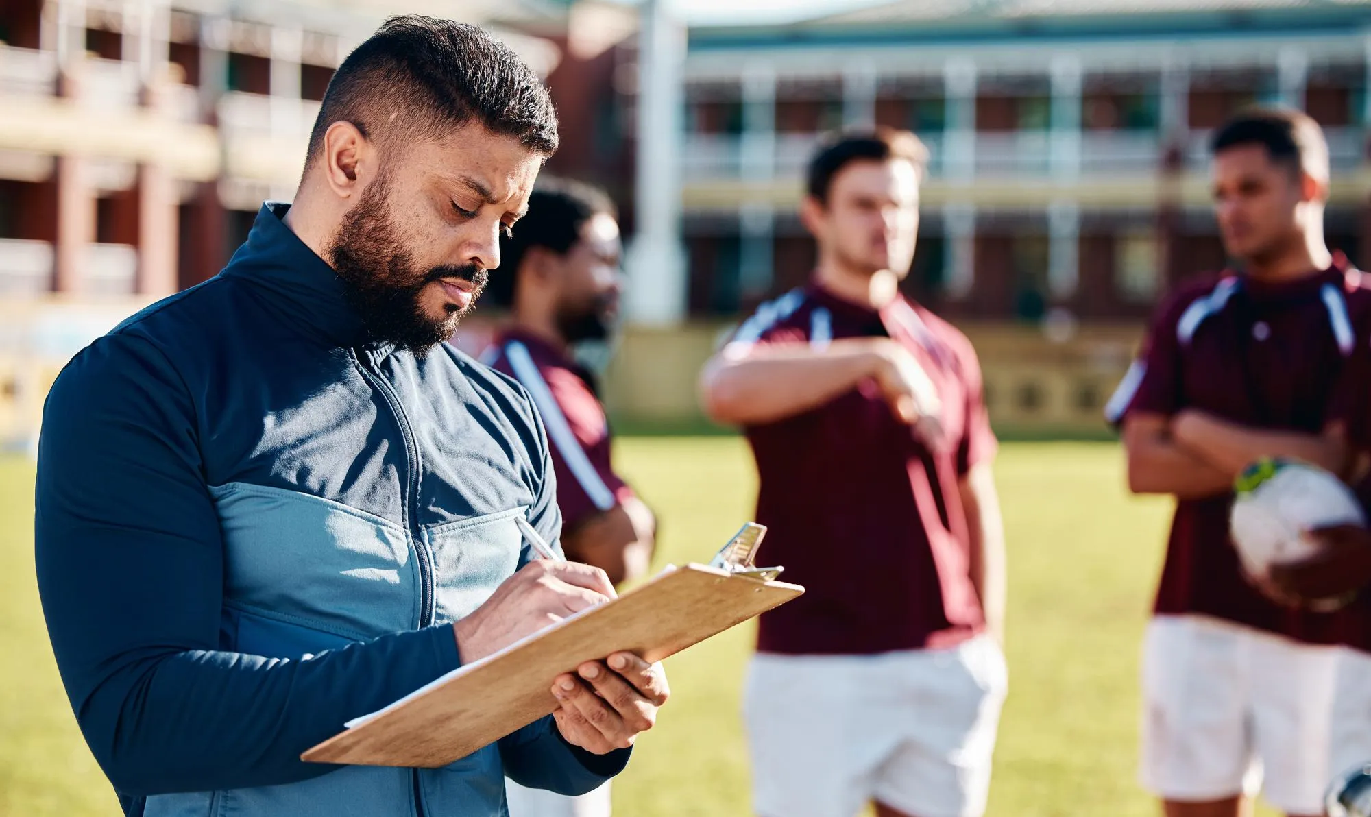 Fitness rugby and coach with clipboard teamwork and training for competition workout and wellness Male trainer and group with healthy lifestyle sports and practice for exercise support or plan