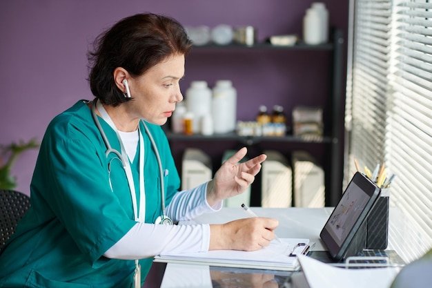 General practitioner video calling colleague