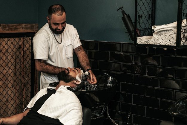Hairdresser serving a client in a barbershop