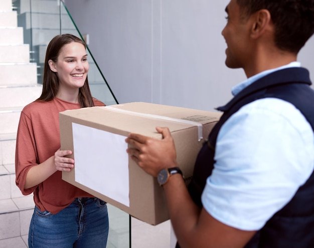 Home box or happy girl with delivery man in house for ecommerce distribution or shipping stock Online shopping mail or customer with supply chain worker for retail sale or product transportation