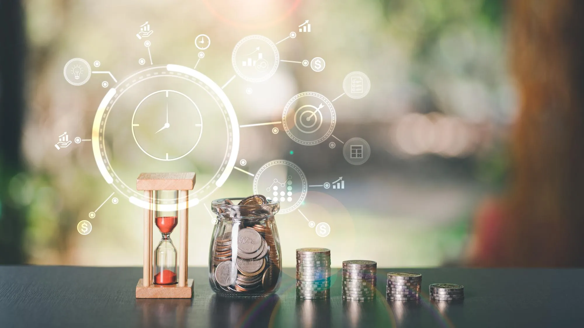 The hourglass the coin and the glass jar all on the tabletime management concepts for saving mone