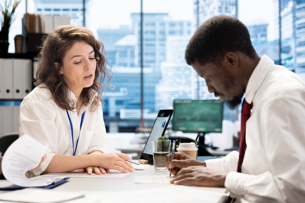 HR employee signing contract with applicant after job interview