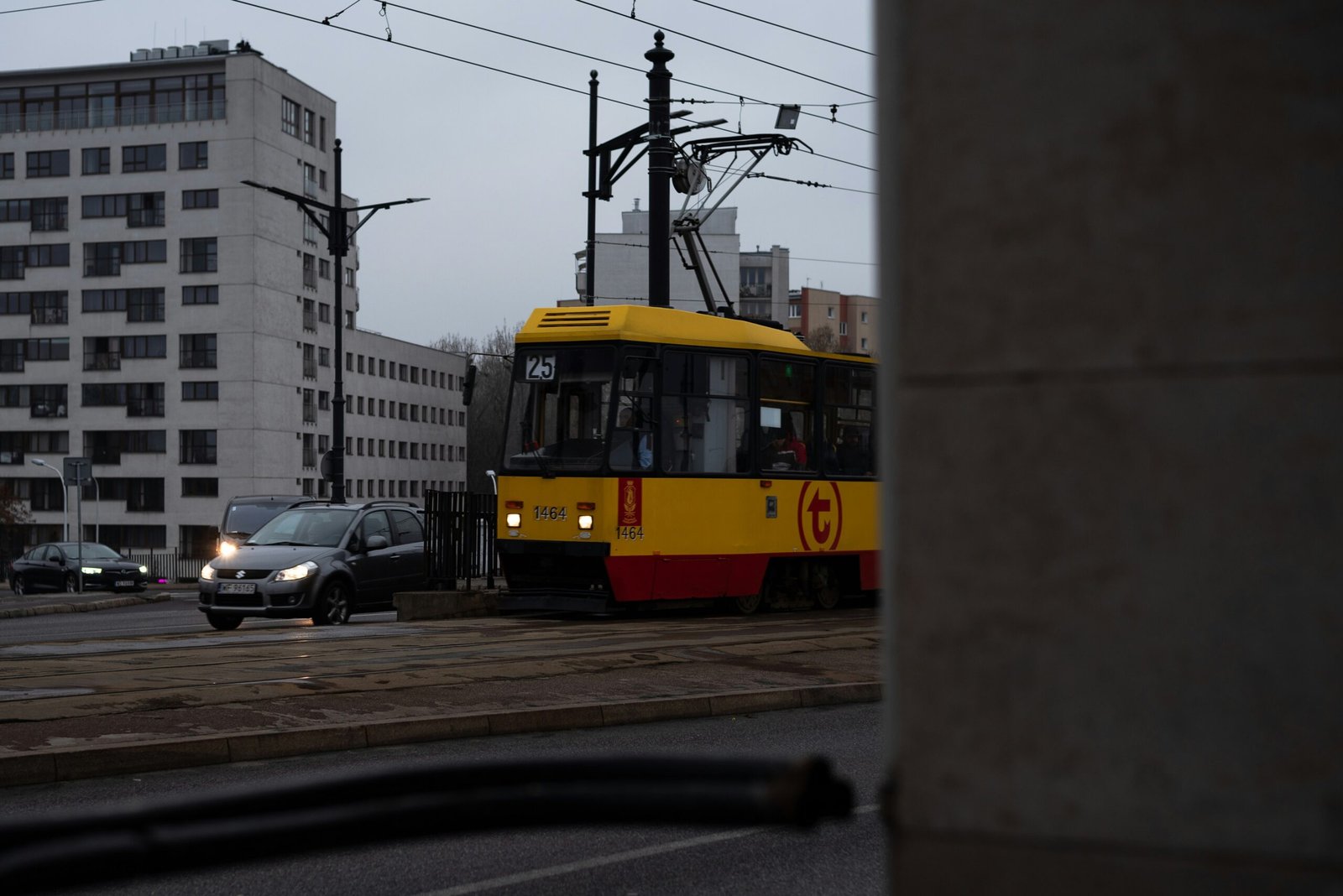 a yellow and red train traveling down train tracks