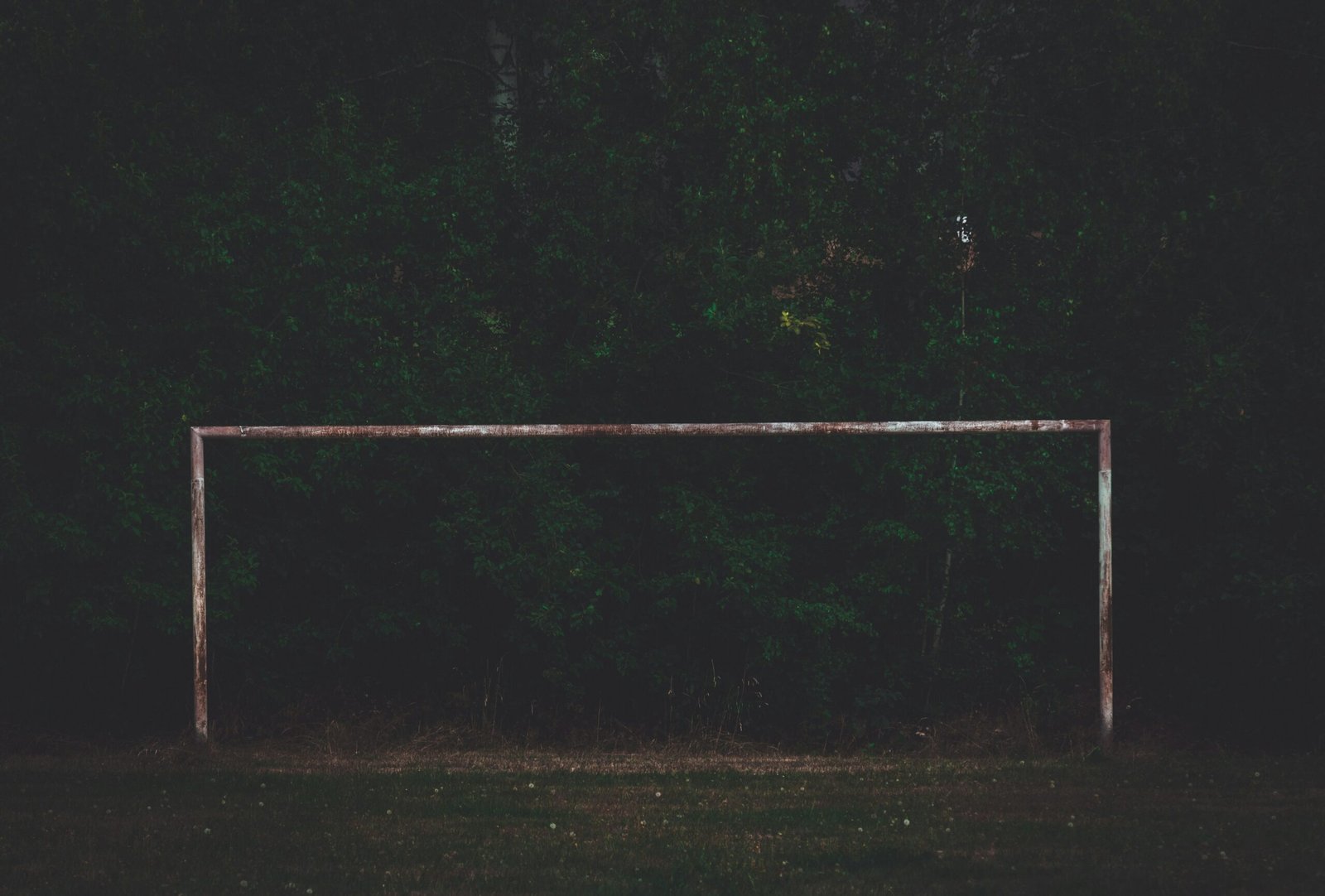 a white trampoline in the dark