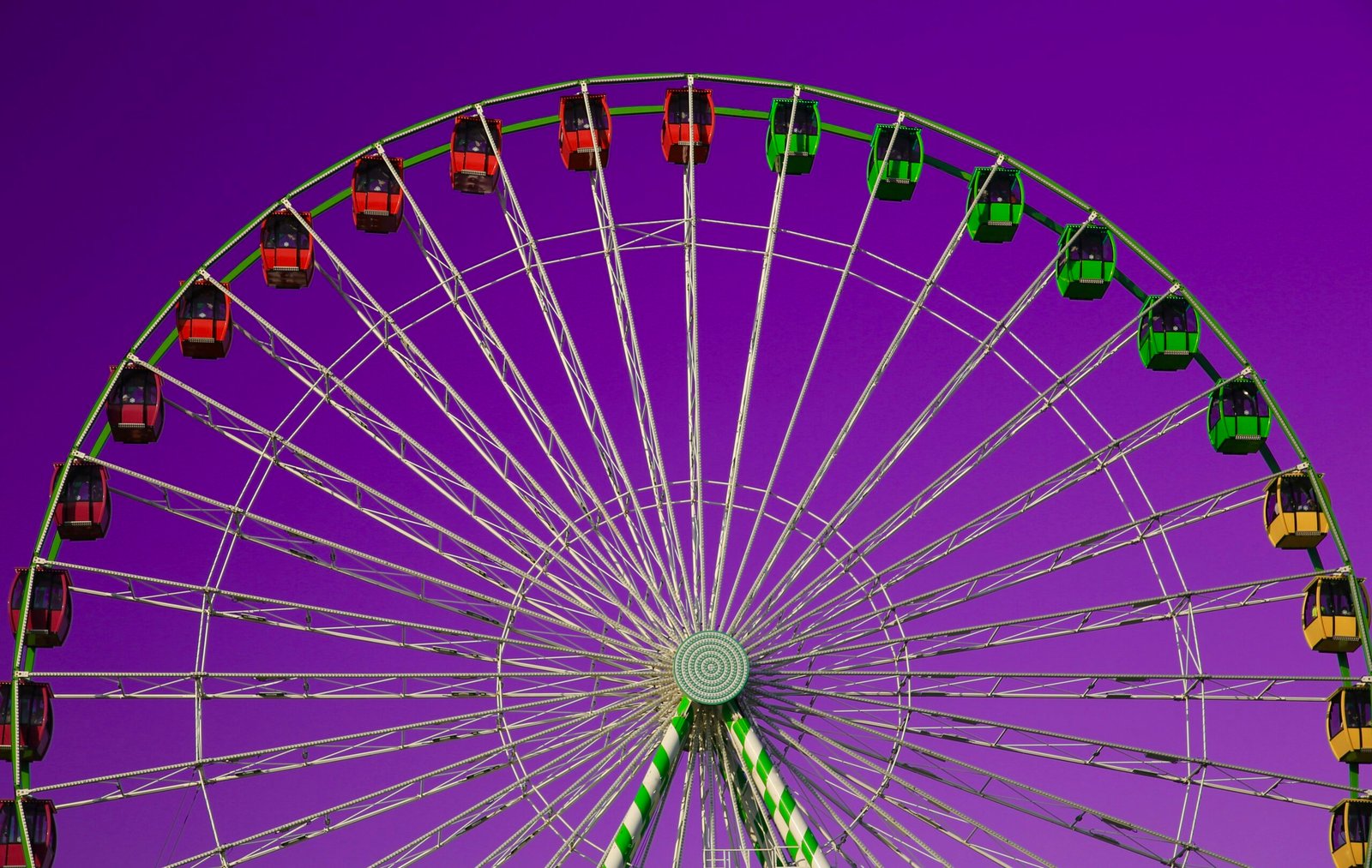 a ferris wheel with a purple sky in the background