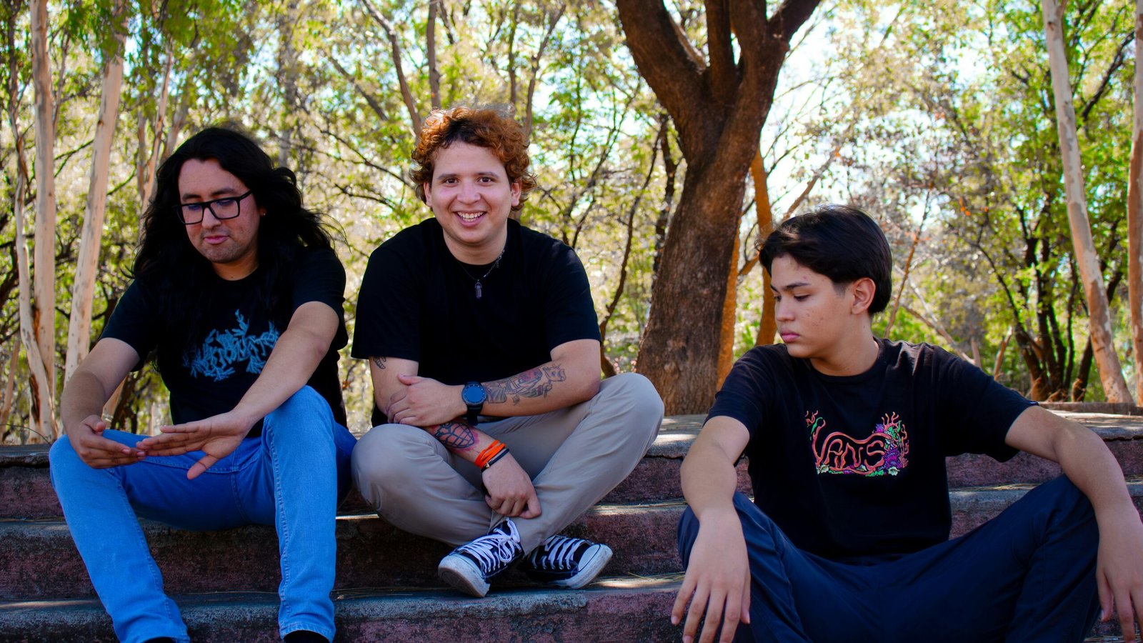 Three friends sitting on outdoor stairs