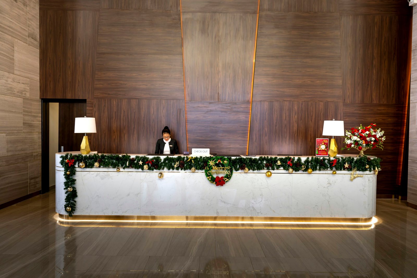 a woman sitting at a desk with a laptop