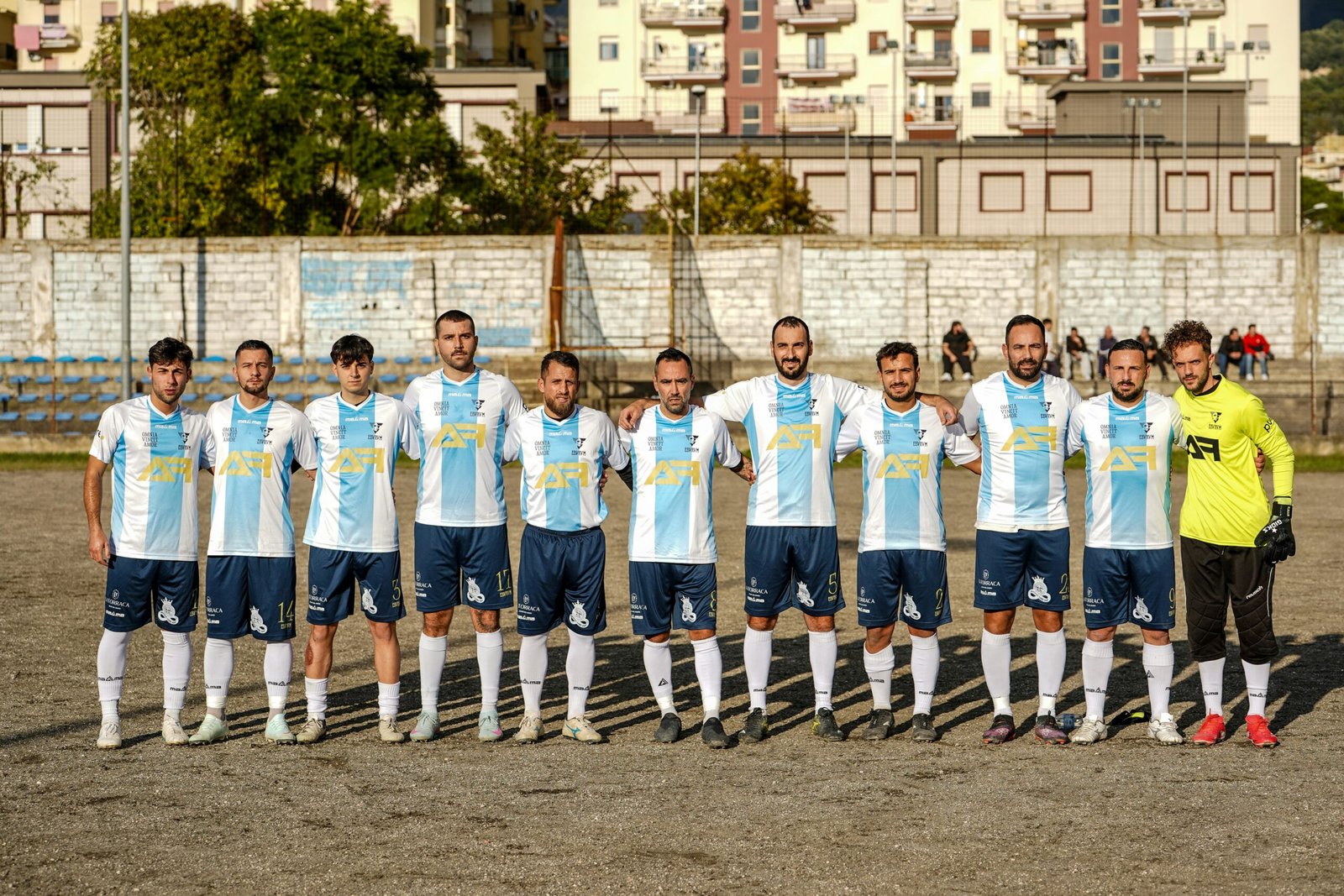 A soccer team poses for a group photograph