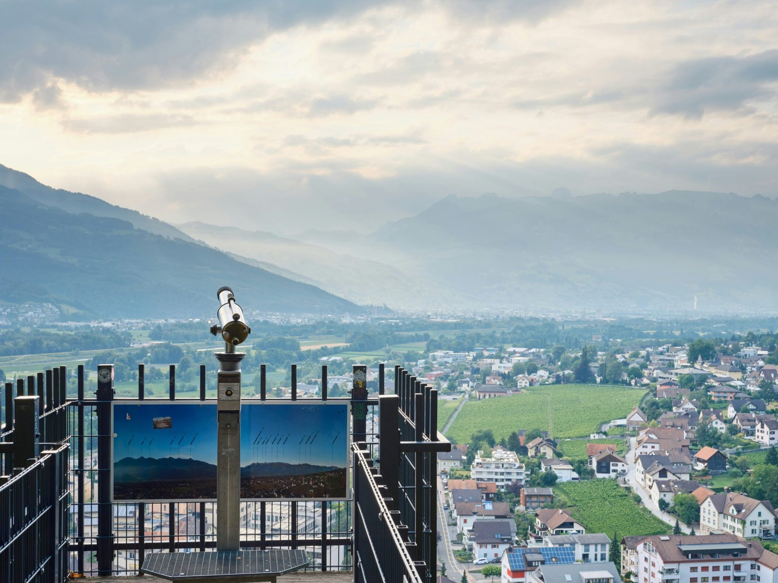 a city with a body of water in the background