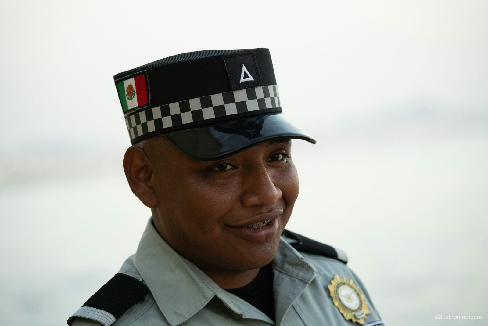 A smiling mexican official is posed for a picture.