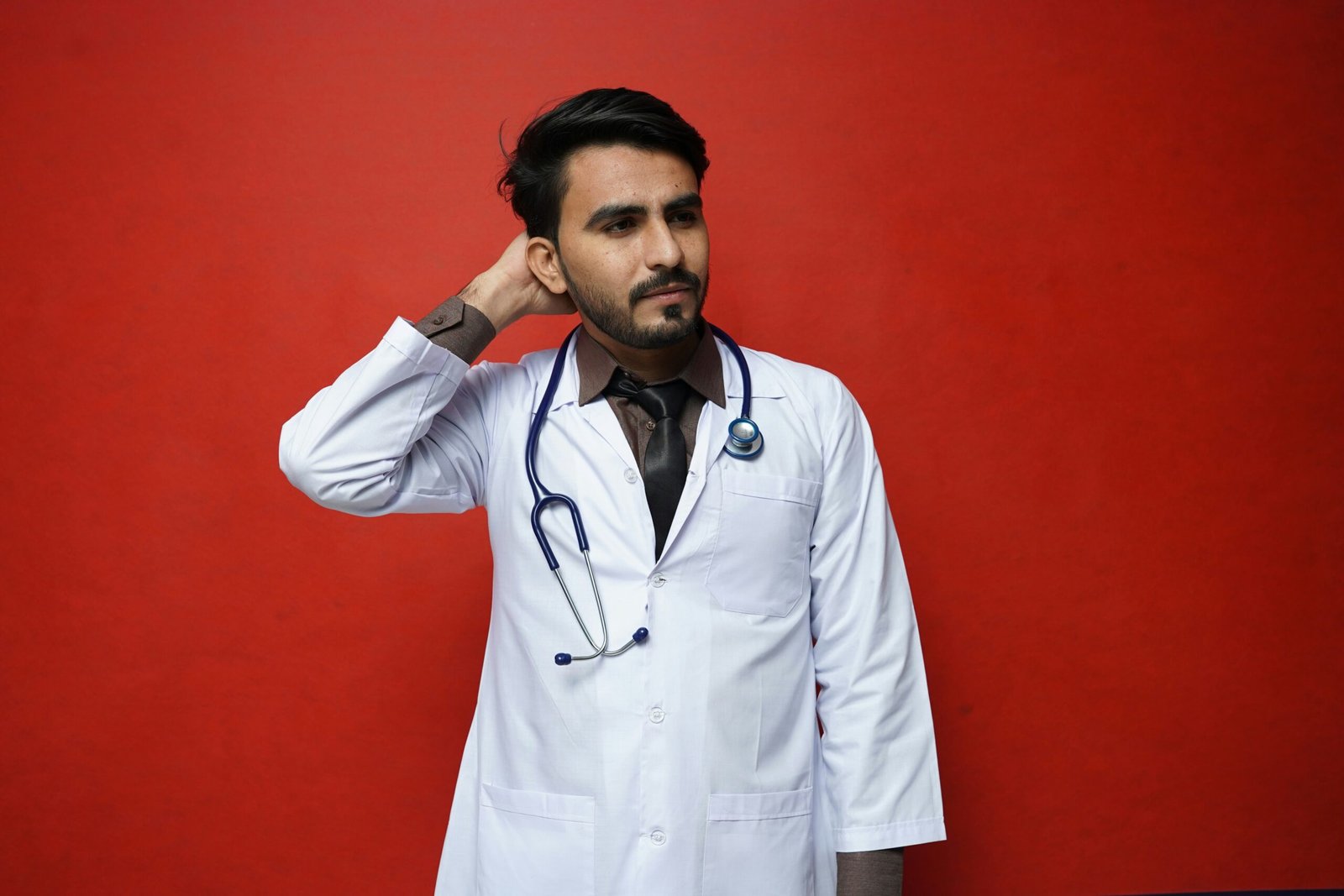 a man with his hand on his head