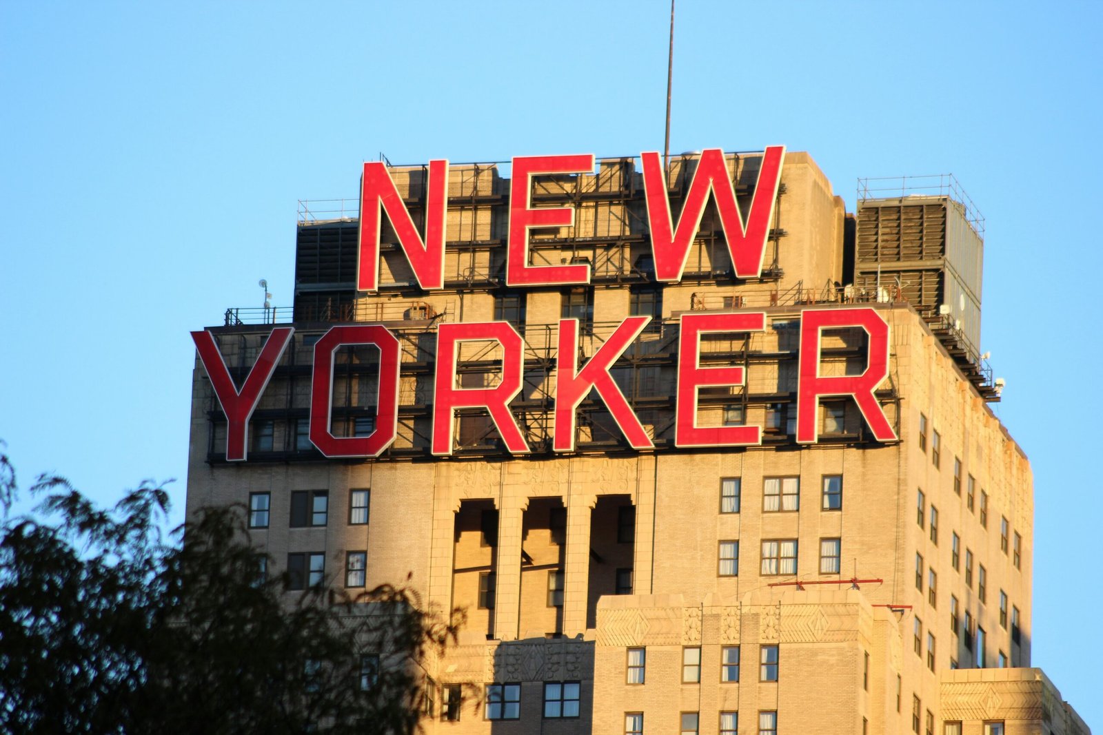 New yorker sign on top of a tall building