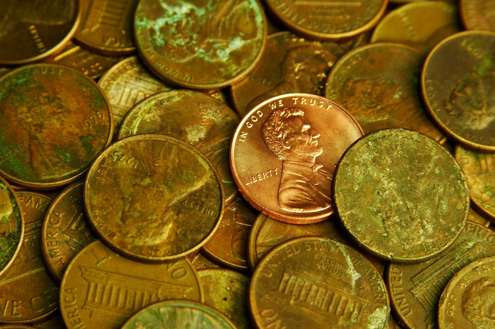 Pile of lincoln pennies with one prominent
