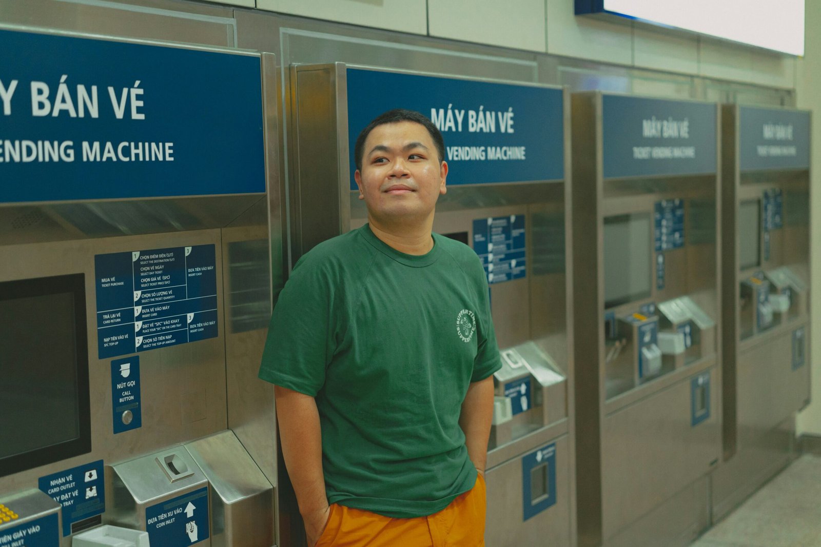 A man standing in front of a row of machines