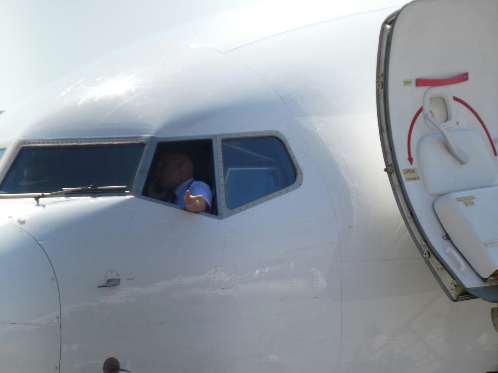 Pilot looking out airplane cockpit window