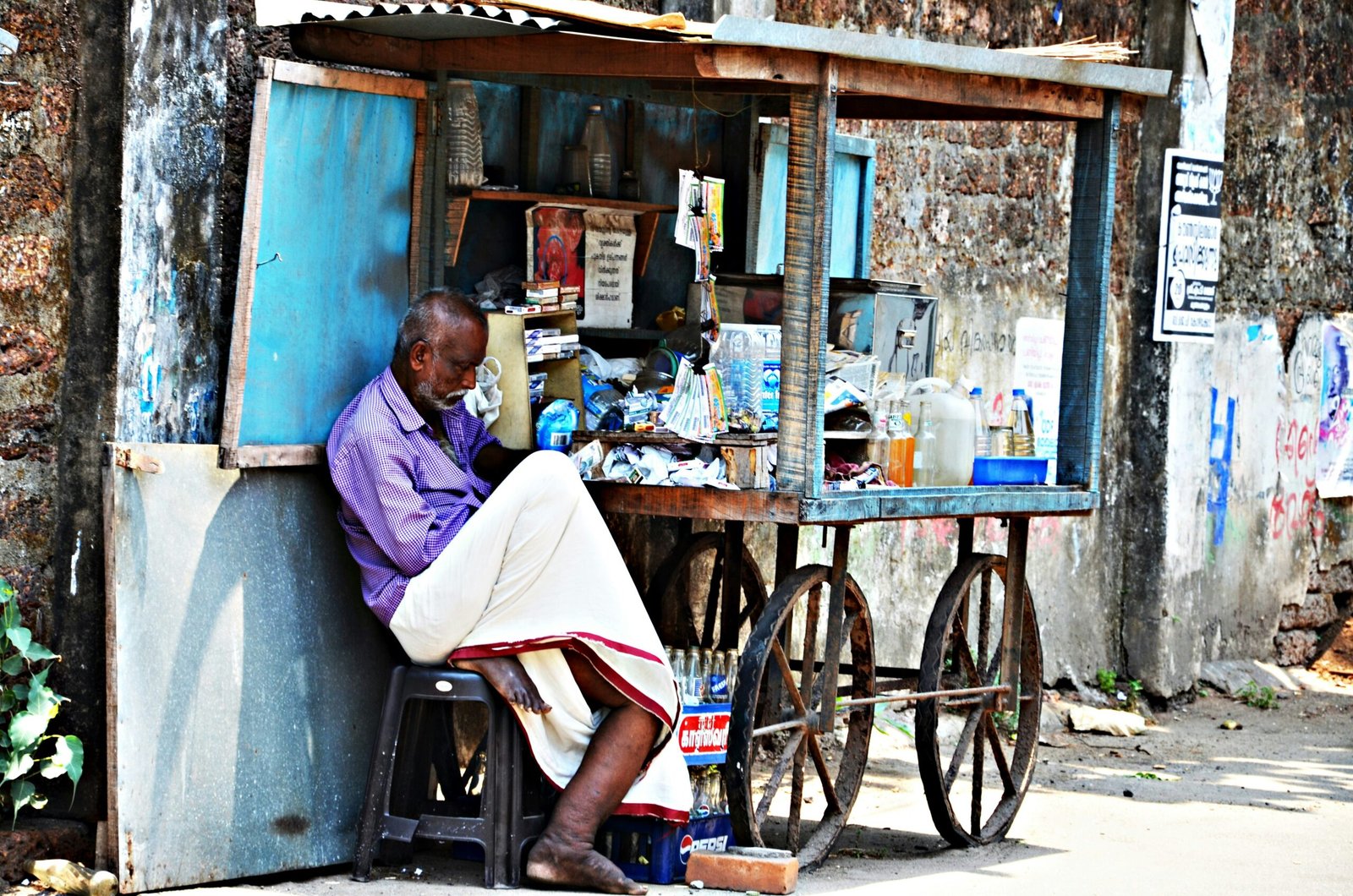 man in white dress shirt sitting on black wheelchair