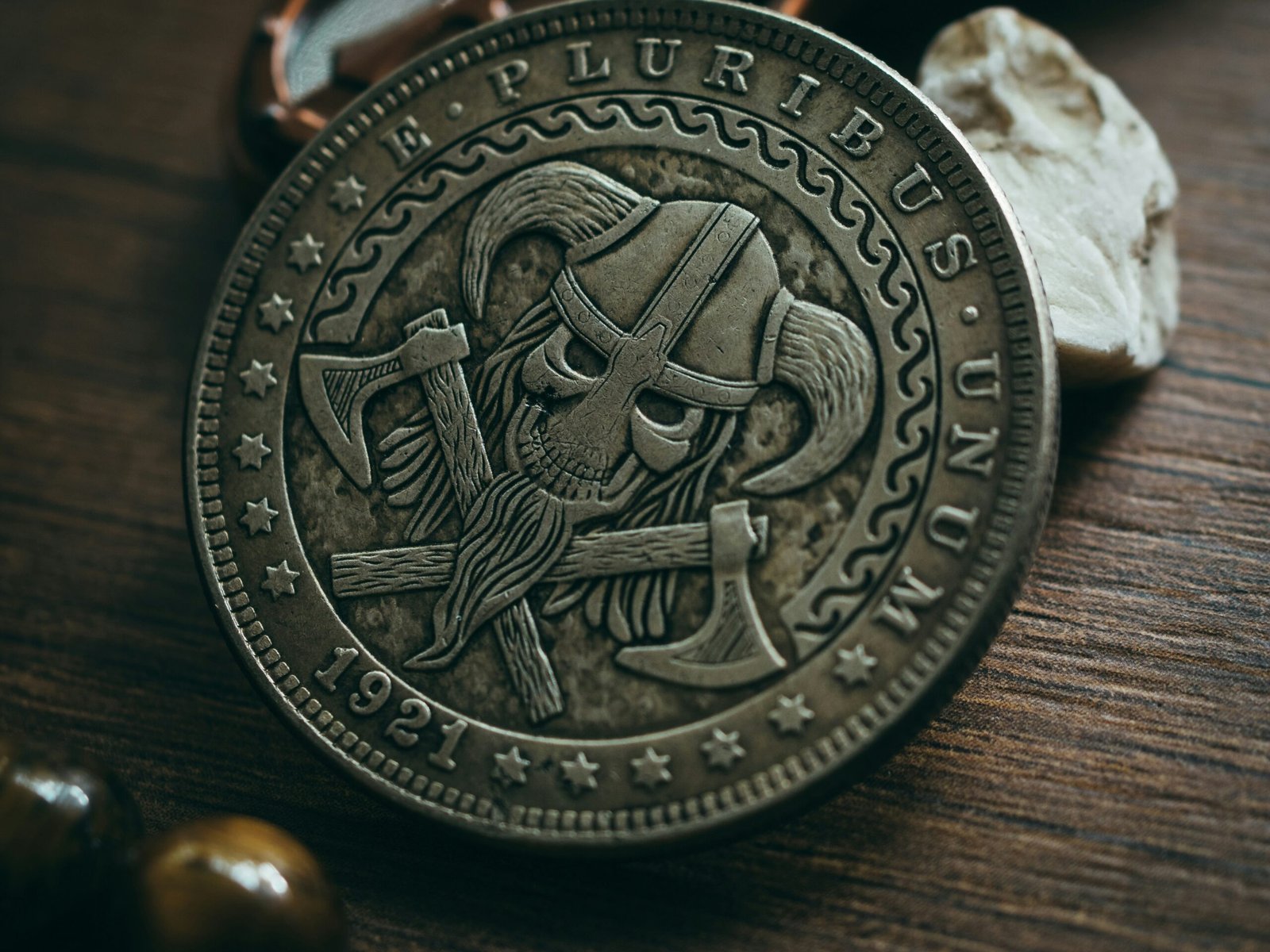 a pirate coin sitting on top of a wooden table