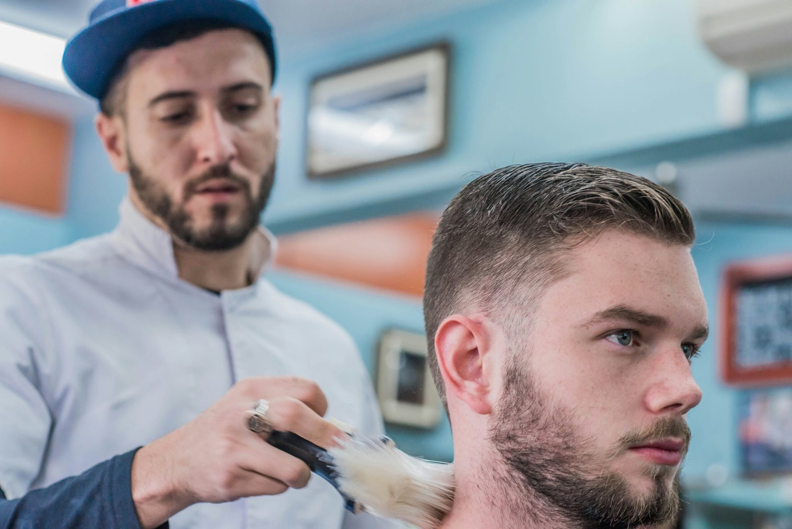 man cutting hair in barber shop
