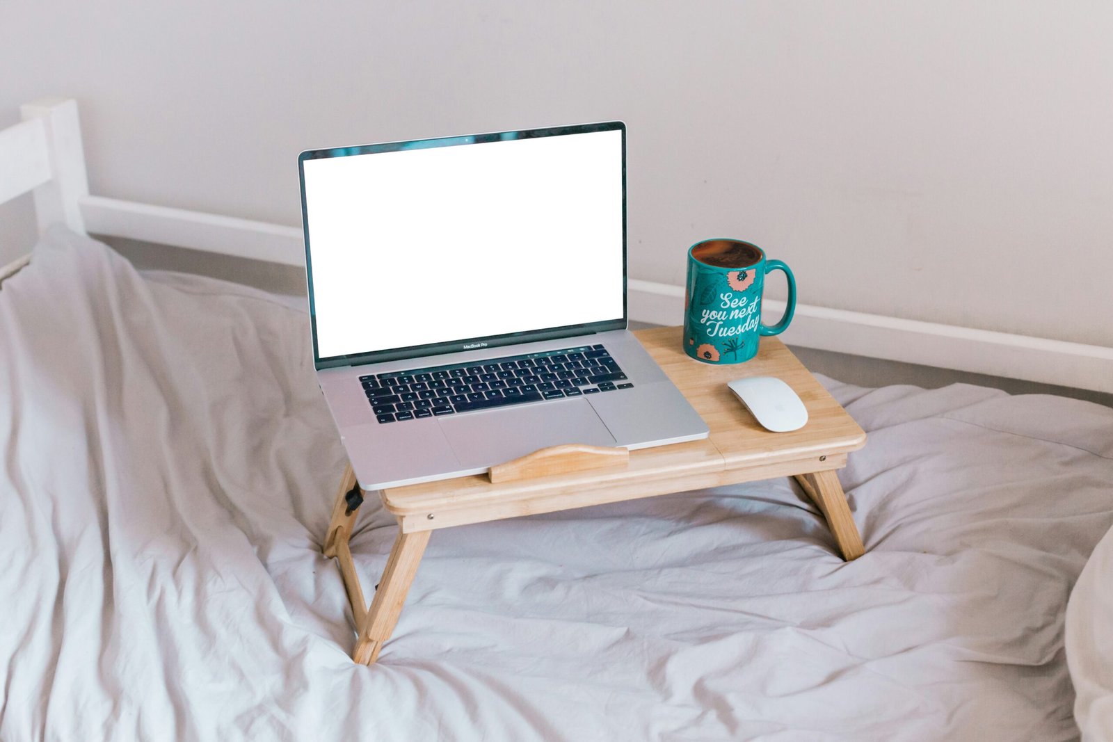 macbook air on brown wooden table