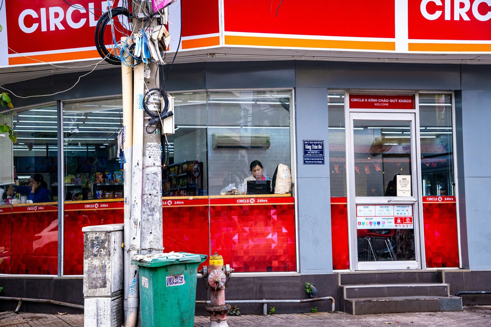 Convenience store entrance with red and gray exterior