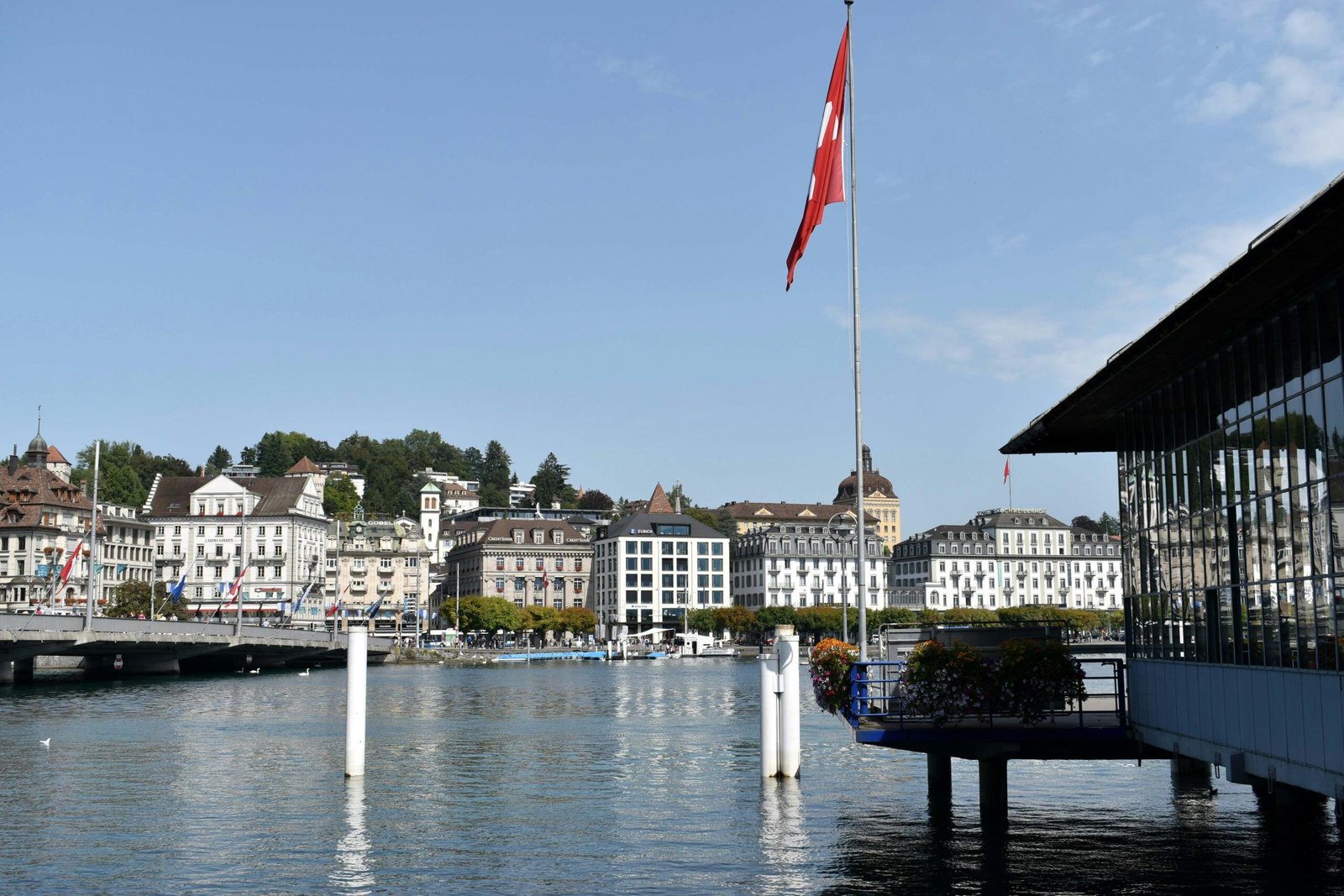 a large body of water with buildings in the background