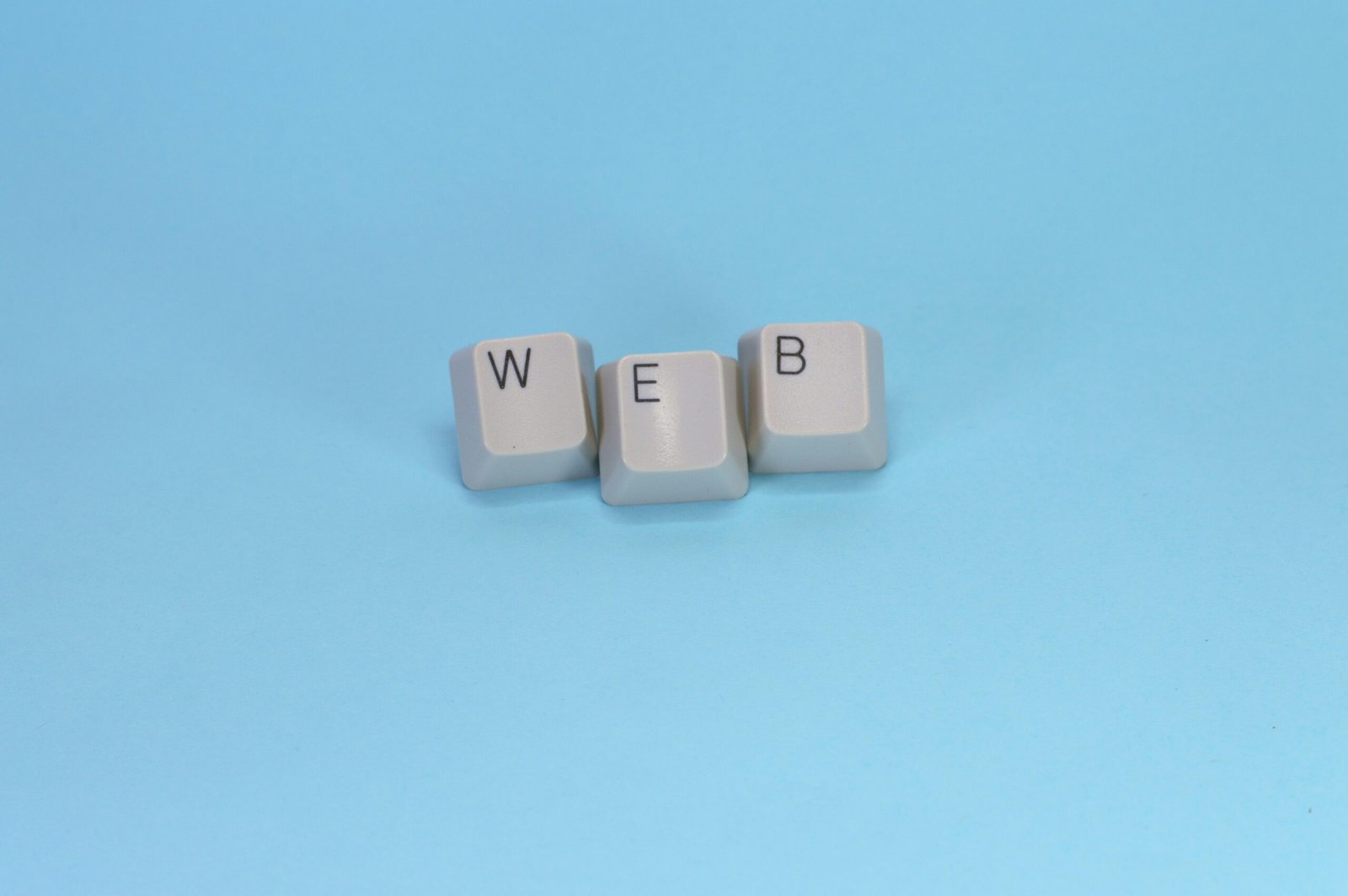 Keyboard keys spell out the word "web."