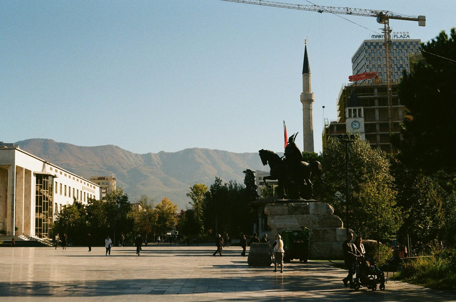 a statue of a man on a horse in the middle of a street