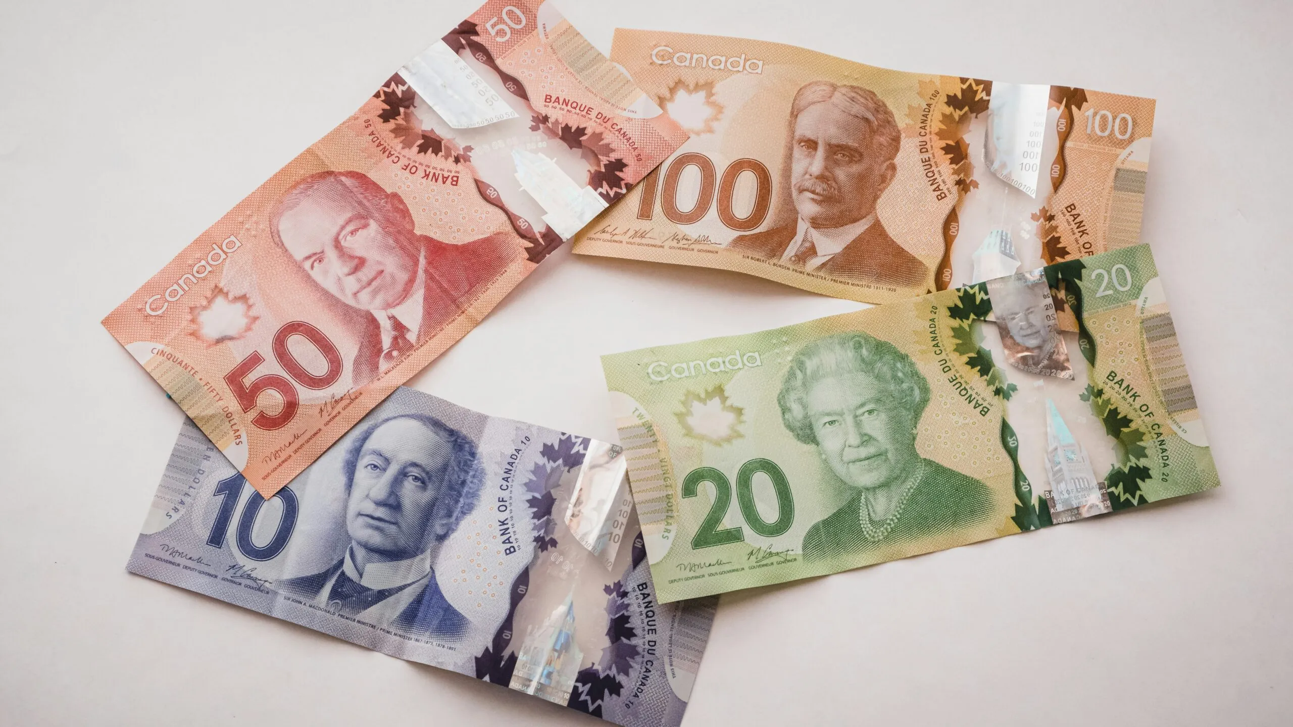 a group of five different bills sitting on top of each other