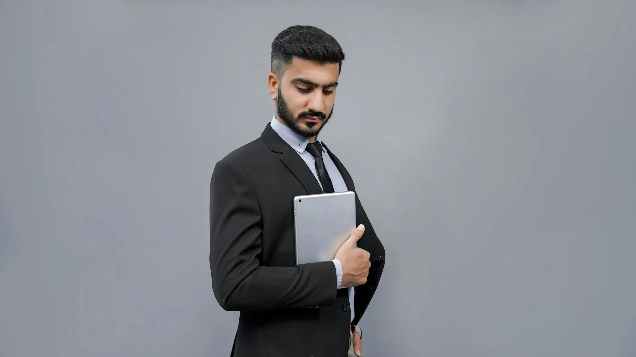 a man holding a tablet